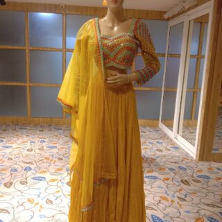 Yellow crop top lehenga for all occasions – parties, engagements, birthdays, mehndi, and more. Versatile and attractive. Code: WCT00141. Contact:7707014061.