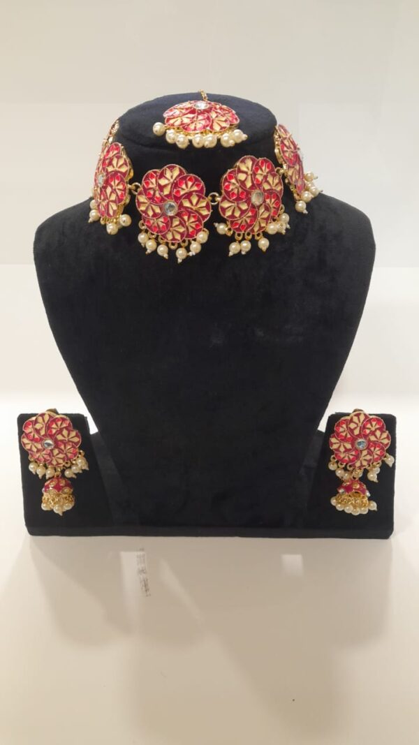 Magenta pearl chokar set party wear set for engagements, mehndi, and haldi ceremonies. Use code WJS00011 to get yours. Contact via WhatsApp at 7707014061.