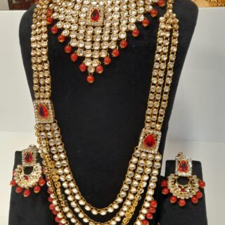 Red bridal kundan set party wear set for engagements, mehndi, and haldi ceremonies. Use code WBR00061 to get yours. Contact via WhatsApp at 7707014061.